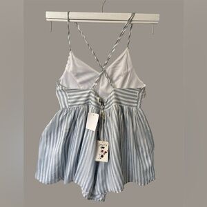 Poof! Elegant jumpsuit with white and blue stripes.
for girls, size M